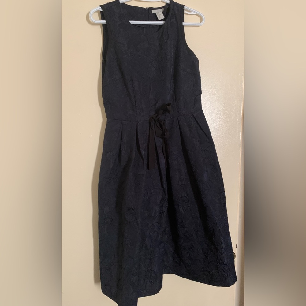 Navy blue dress with black bow. Size 8.